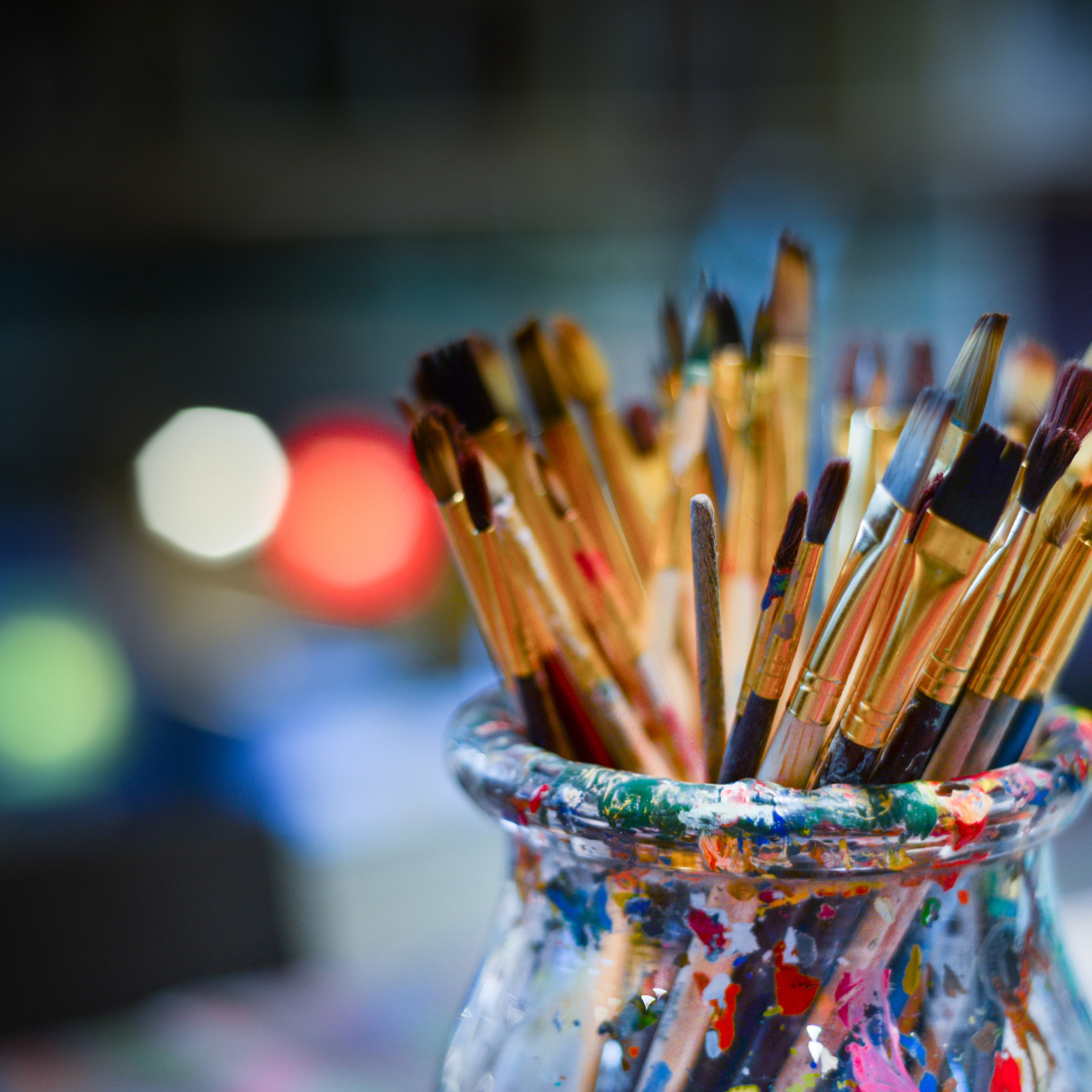 Paint brushes in pot Paint bushes and pencils in a jar