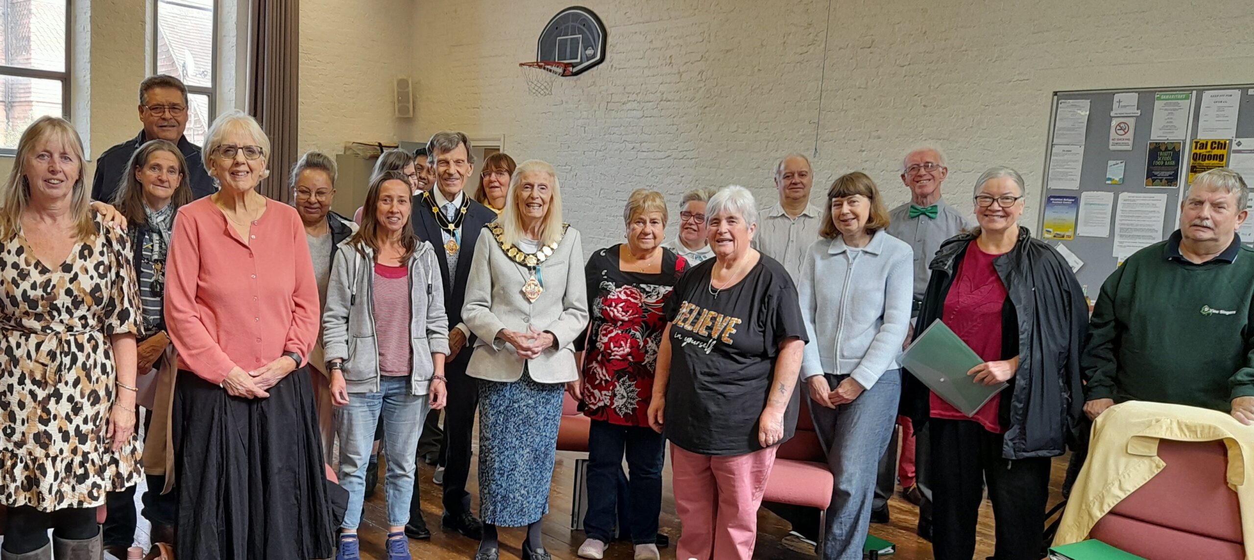 A group of people standing with a Mayor